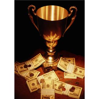A Picture of a Pile of Notes and a Gold Cup